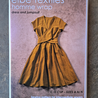 Elbe Textiles homme wrap dress and jumpsuit sewing pattern packaging on a textured surface
