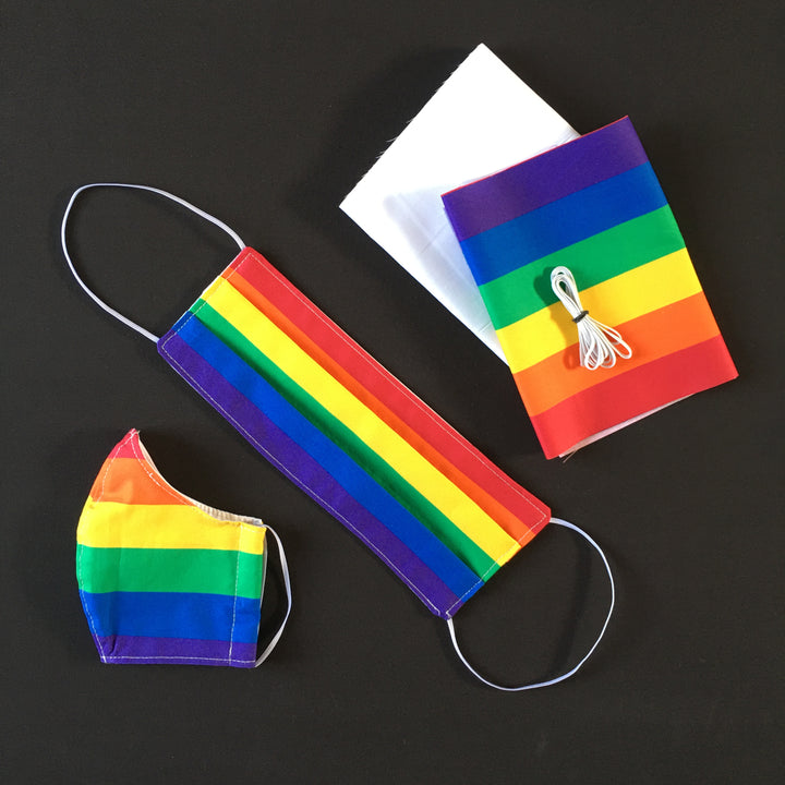 A flat lay image of masks made from Pride Flag Fabric from RICK RACK Textiles