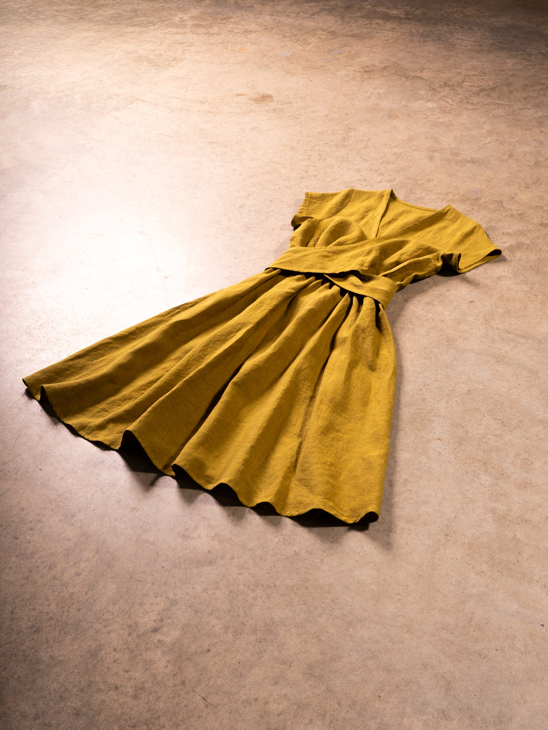 Yellow dress on a beige carpet