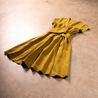 Yellow dress on a beige carpet